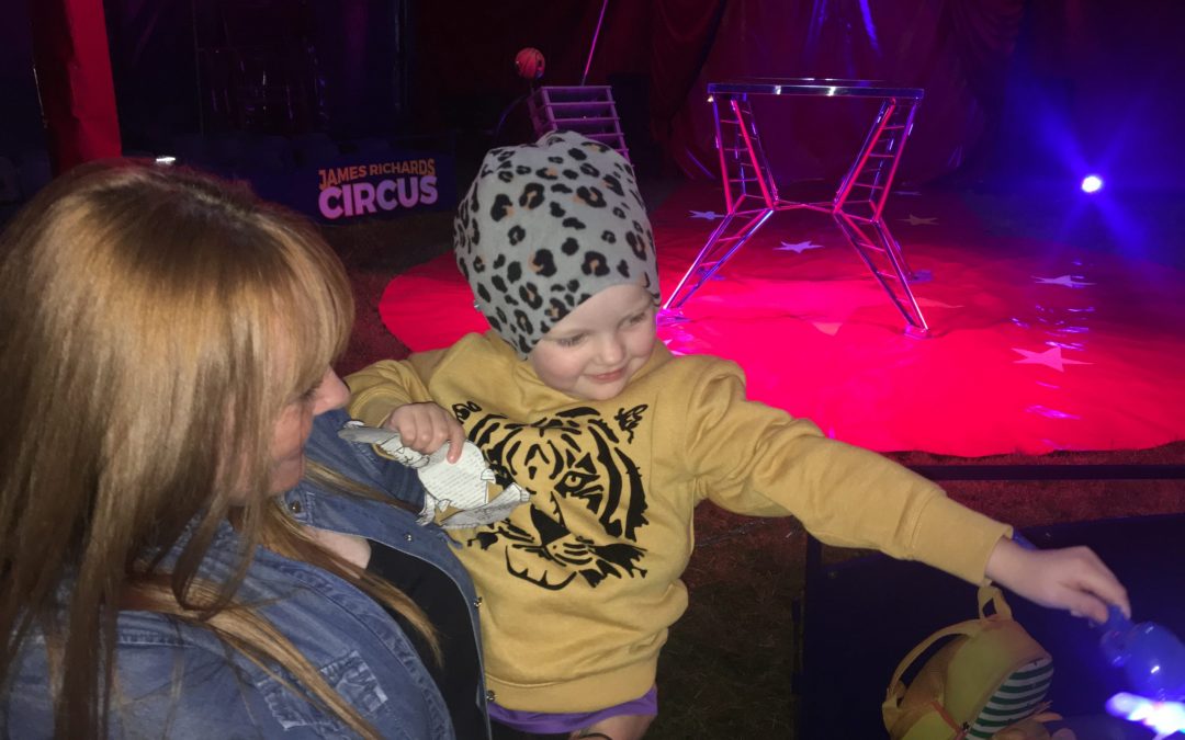 BEDE SPENDS DAY AT THE CIRCUS WITH HER PARENTS.
